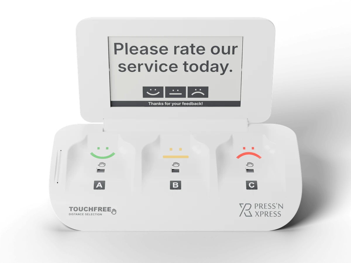 Press'nXPress TouchFree feedback terminal showing 'Please rate our service today.' above three touchless smiley pads, rendered from the product's CAD model